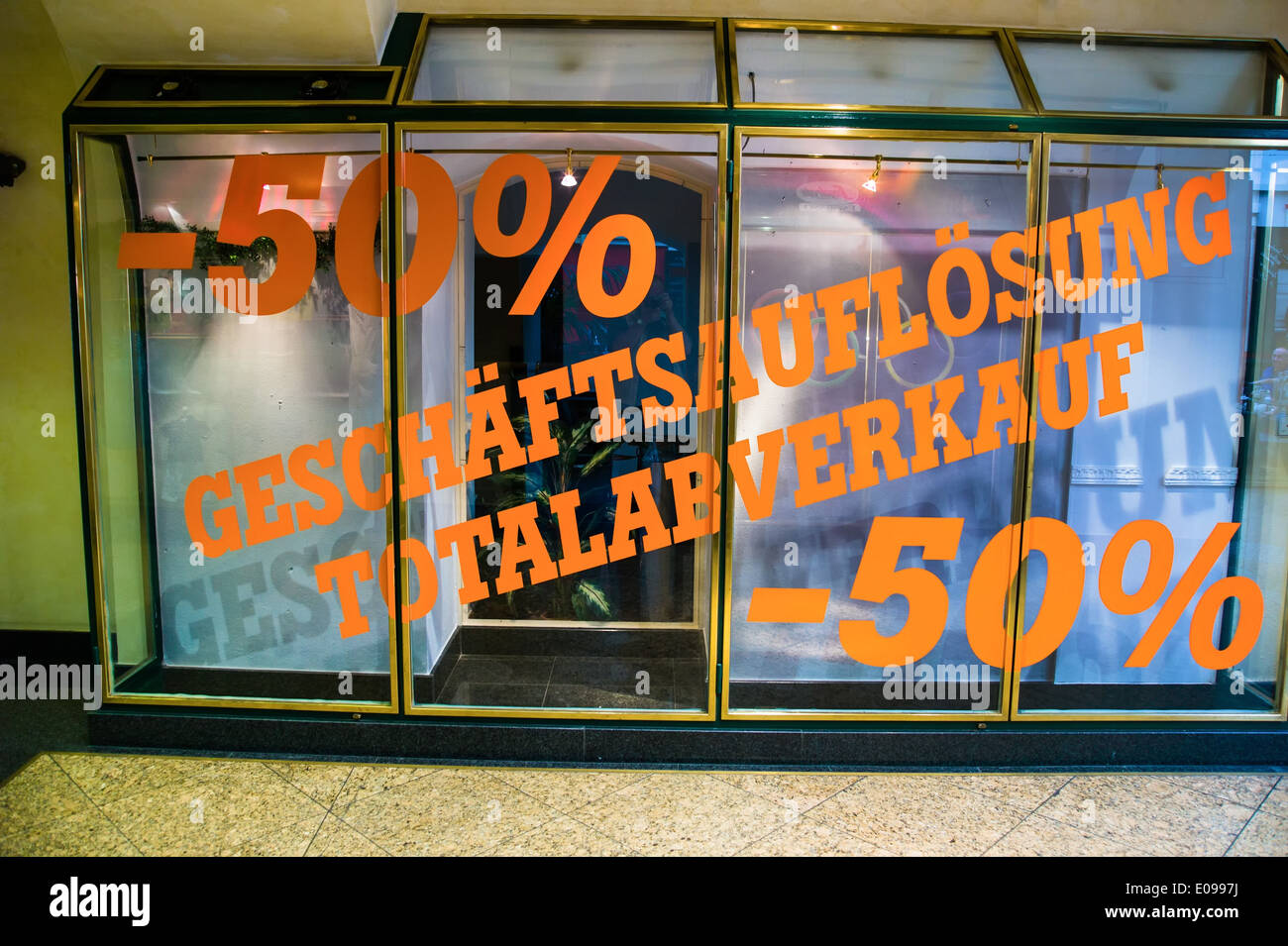 Big discount action because of a liquidation. Writing on shop-window. Symbolic photo fue bankruptcy and retirement., Grosse Raba Stock Photo