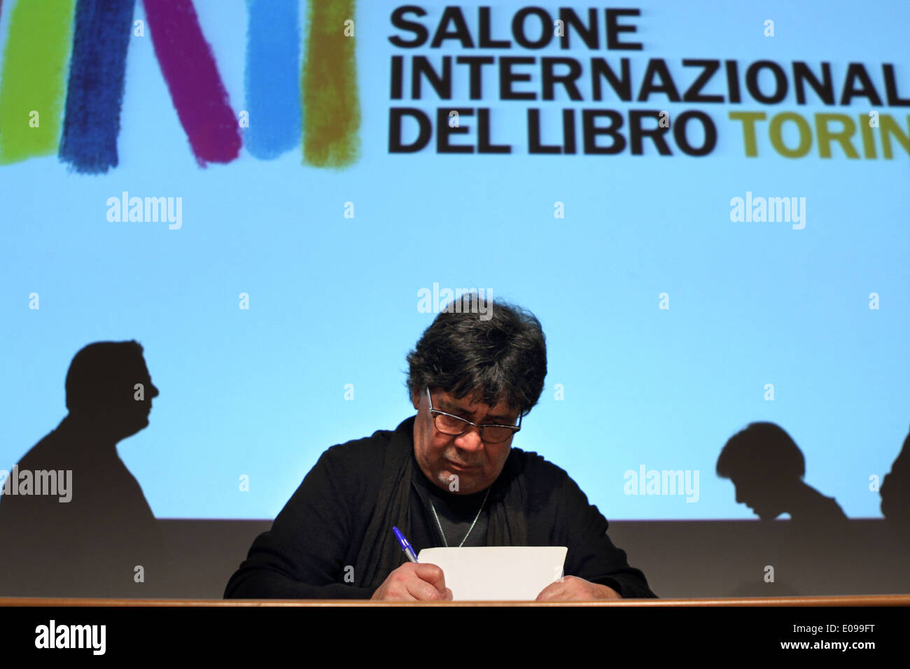 Chilean writer Luis Sepulveda (born in 1949) signing autographs at 2013 Torino Book Fair. Stock Photo