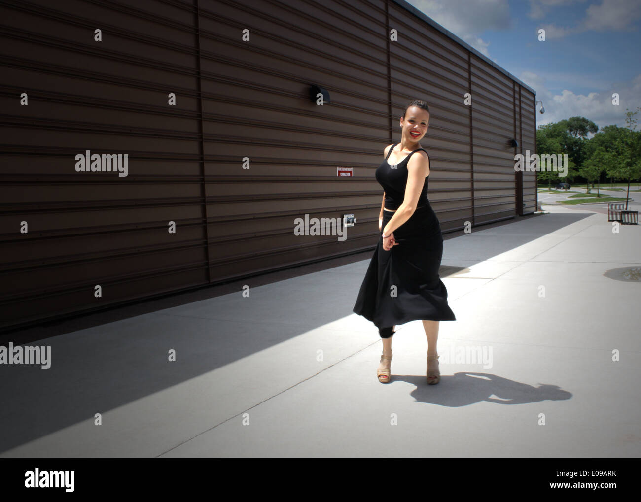 Girl in a black dress dances flamenco on the street in Toronto, Canada Stock Photo
