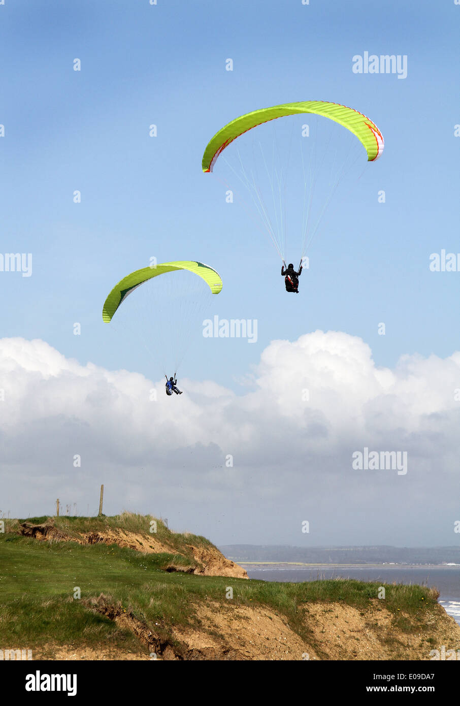 Paragliding with parachutes over clay cliffs, east Yorkshire. Stock Photo
