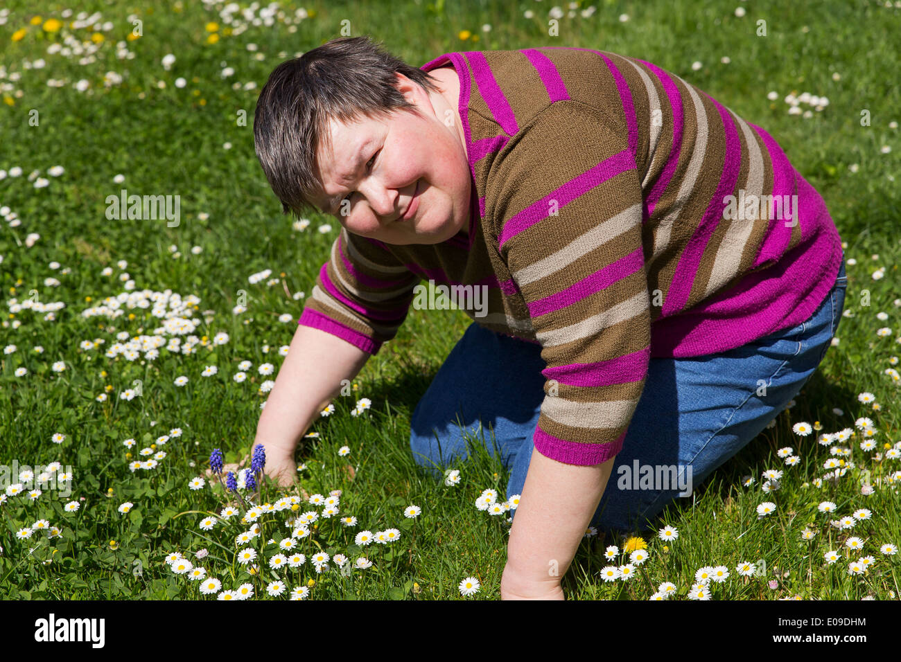 mentally disabled woman on a meadow Stock Photo