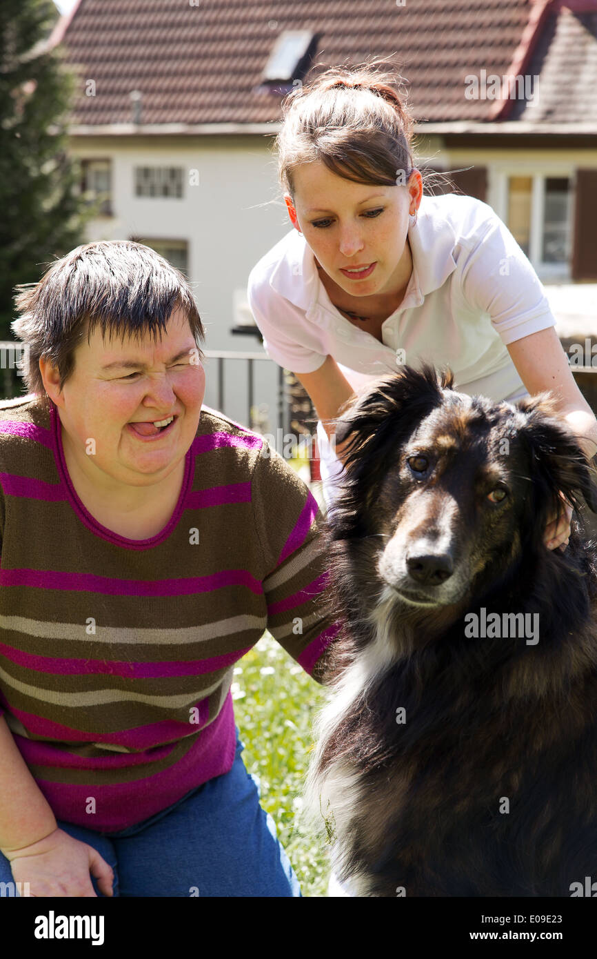 disabled woman is making a animal-assisted therapy Stock Photo