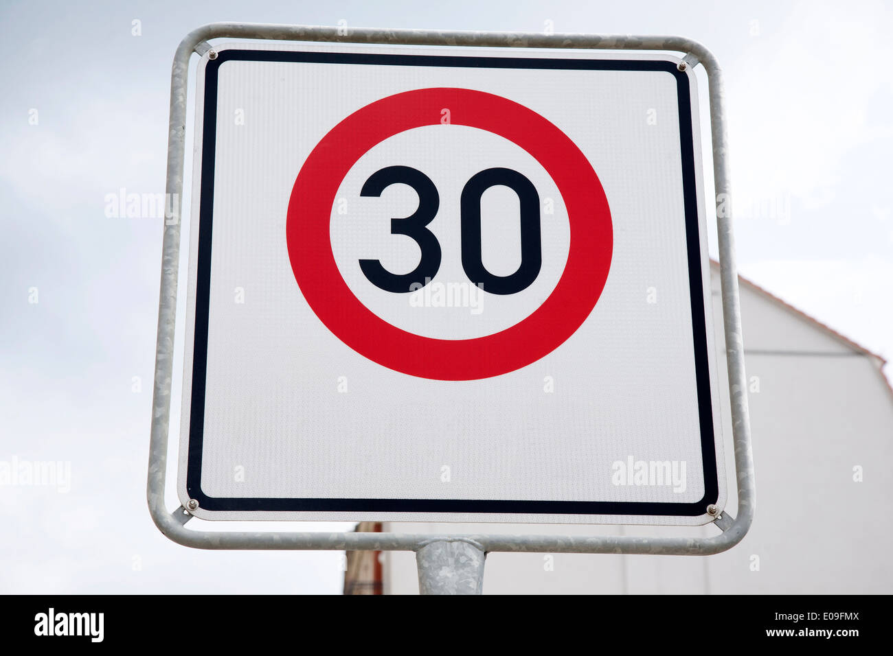 Red Thirty Speed Sign in Urban Setting Stock Photo - Alamy