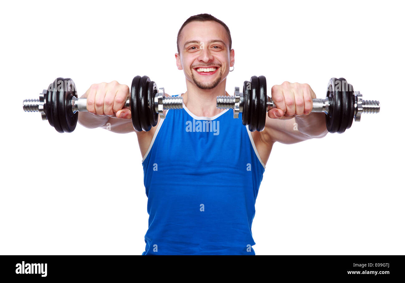 Smiling sports man working out with dumbbells on white background Stock Photo