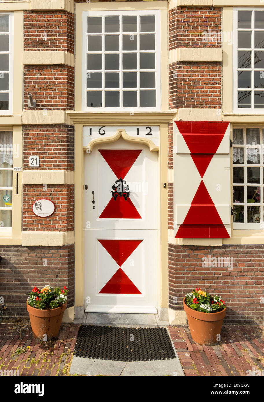 STADSTIMMERWERF HOUSE WITH RED AND WHITE SHUTTERS FROM 1612 ON THE KORT GALGEWATER CANAL IN LEIDEN HOLLAND Stock Photo