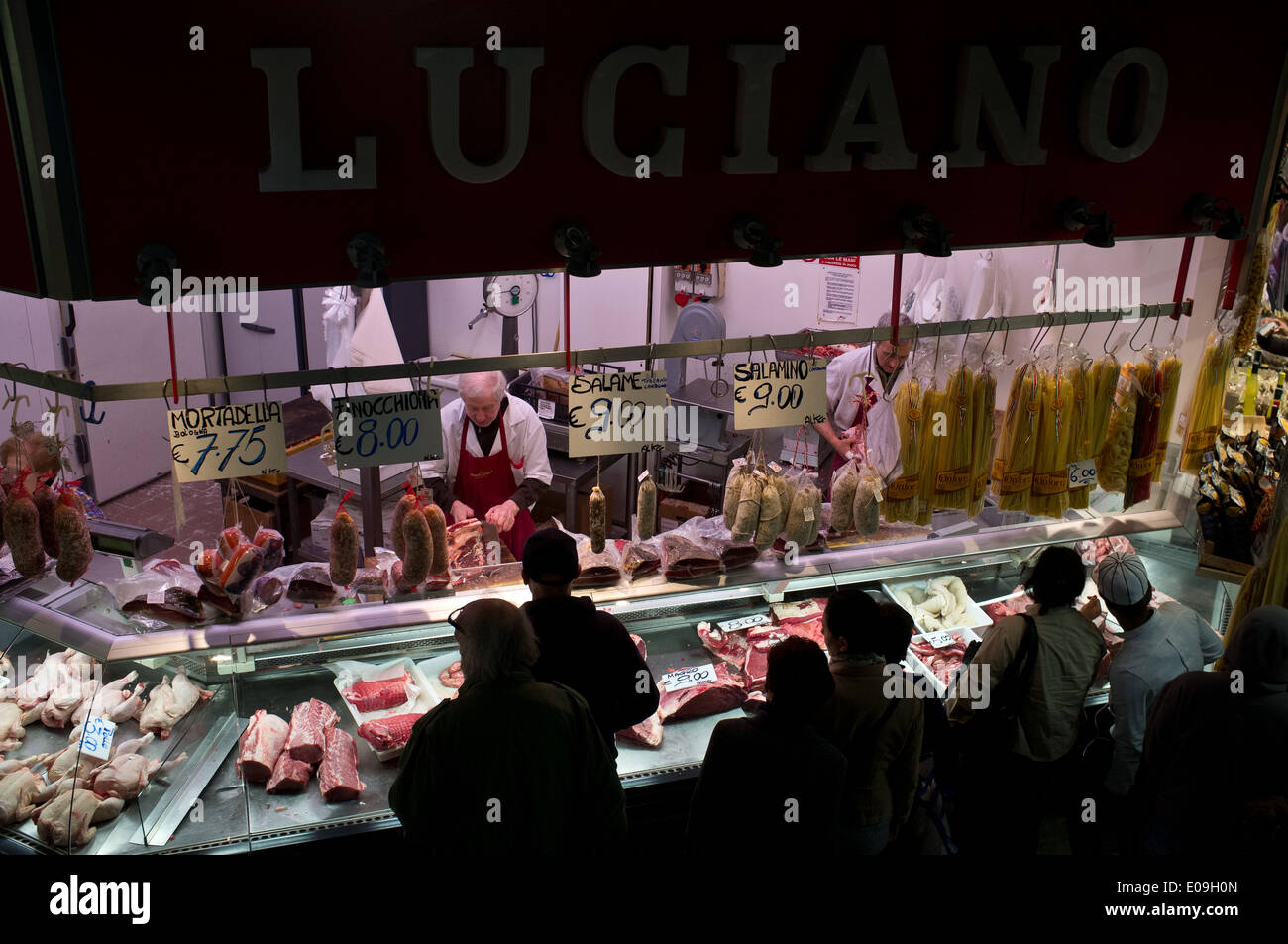A butcher sells meat at Luciano's meat stand in the Mercato Centrale di San Lorenzo Market, offering primary ingredients of Tusc Stock Photo