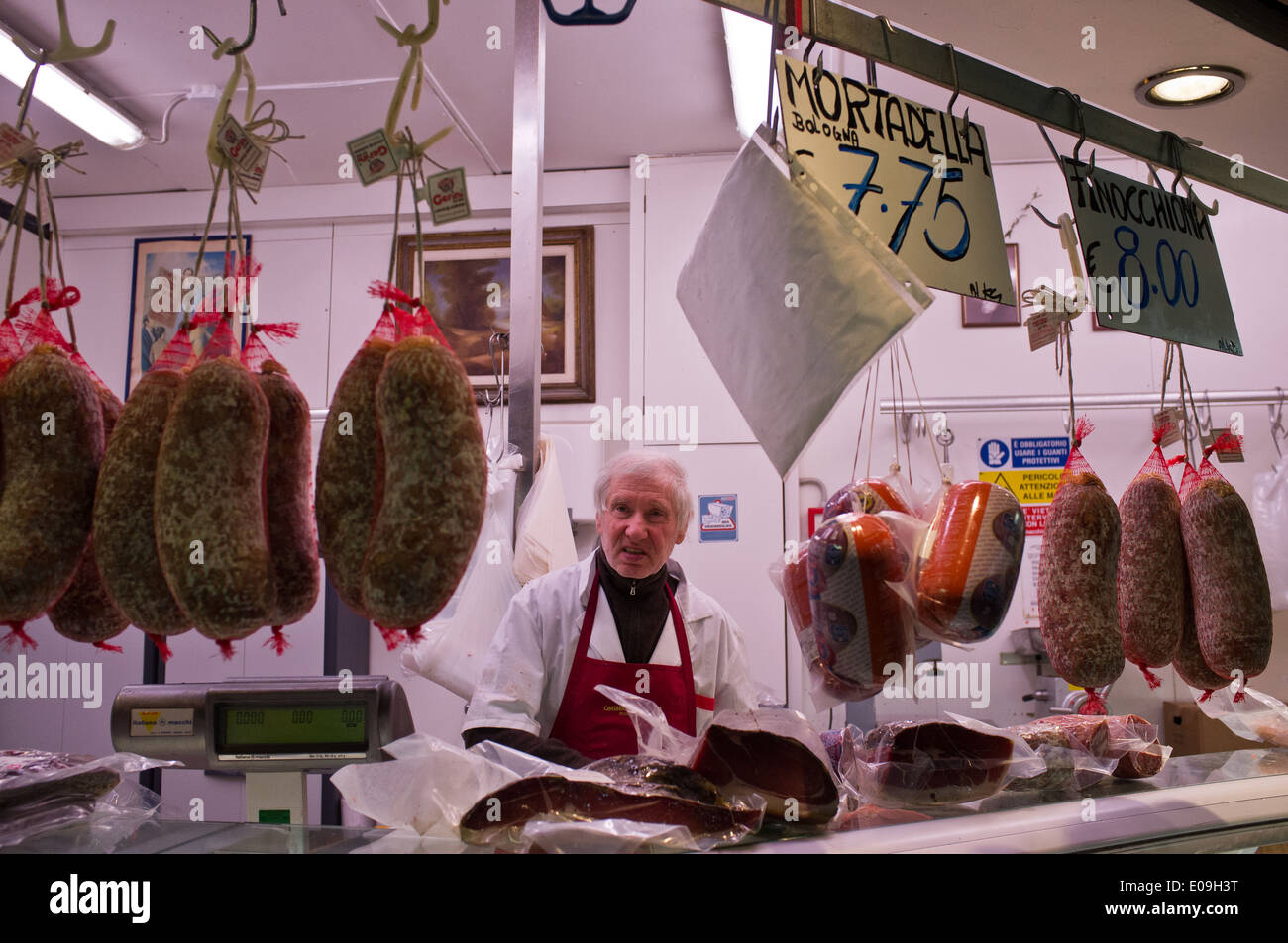 A butcher sells meat at Luciano's meat stand in the Mercato Centrale di San Lorenzo Market, offering primary ingredients of Tusc Stock Photo