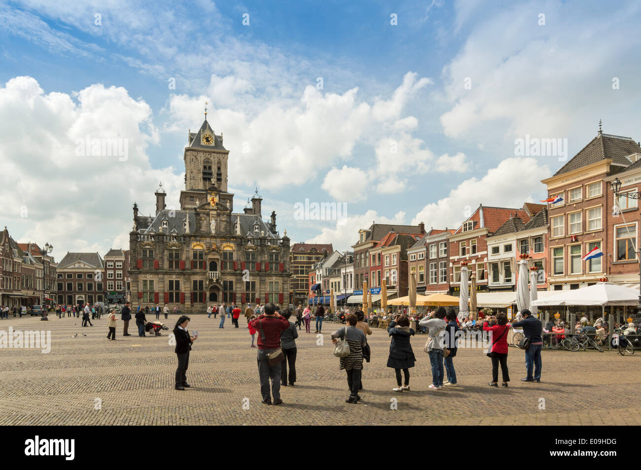 MARKT SQUARE DELFT HOLLAND WITH TOURISTS PHOTOGRAPHING THE CITY HALL OR STADHUIS Stock Photo