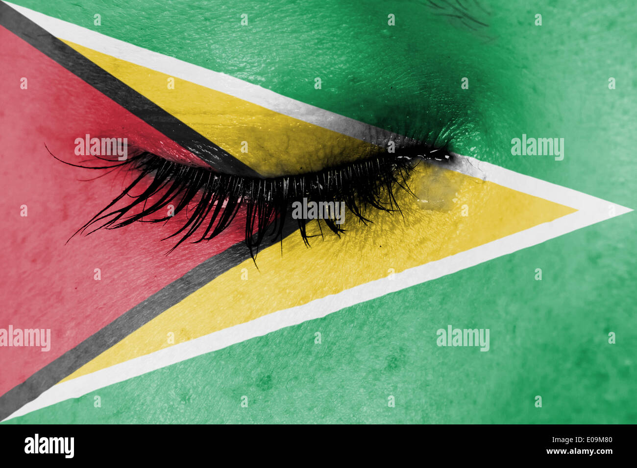 Crying woman  pain and grief concept  flag of Guyana Stock Photo