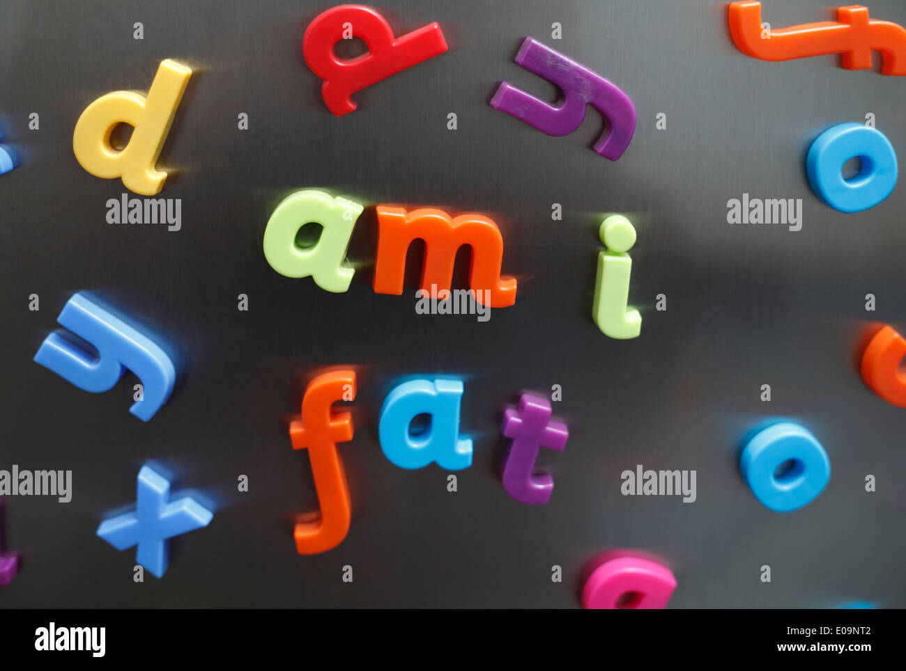 'am i fat' in plastic magnetic letters on a fridge door. Stock Photo
