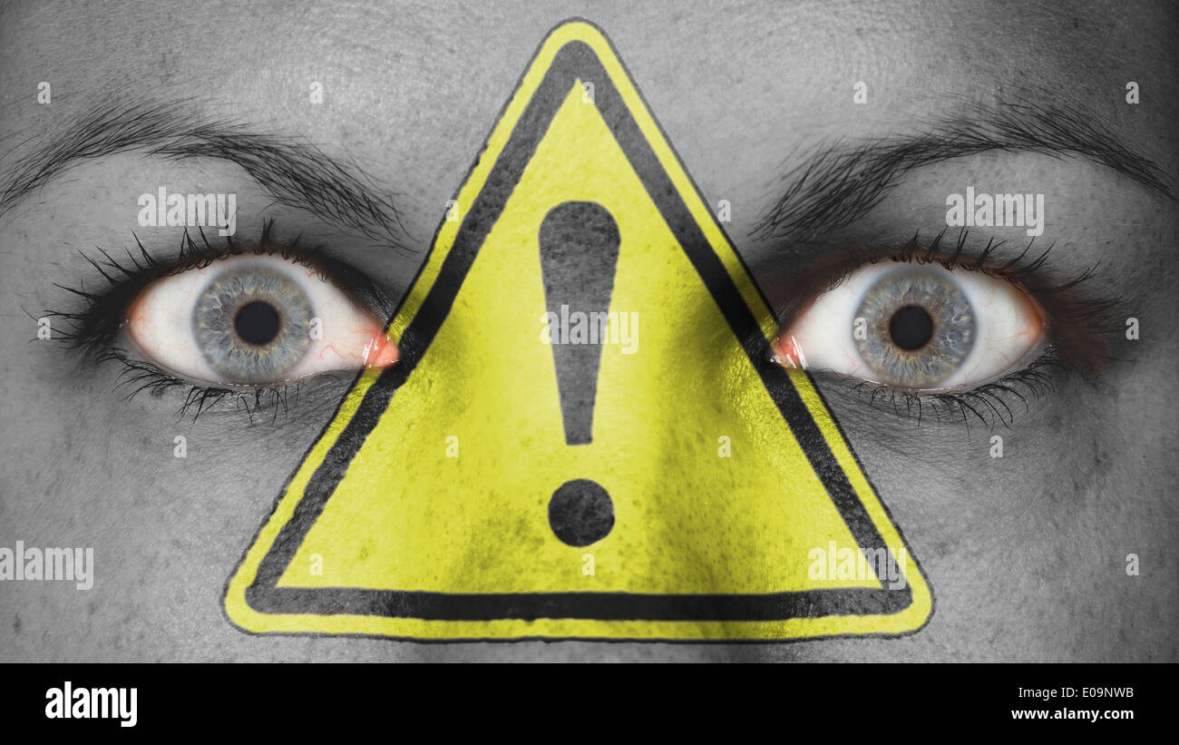 Close up of eyes. Painted face danger exclamation mark Stock Photo Alamy