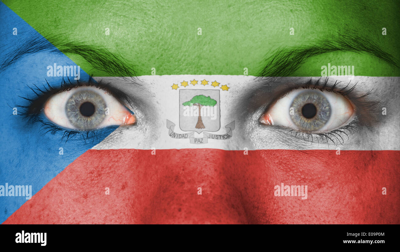 Close up of eyes. Painted face with flag of Equatorial Guinea Stock Photo