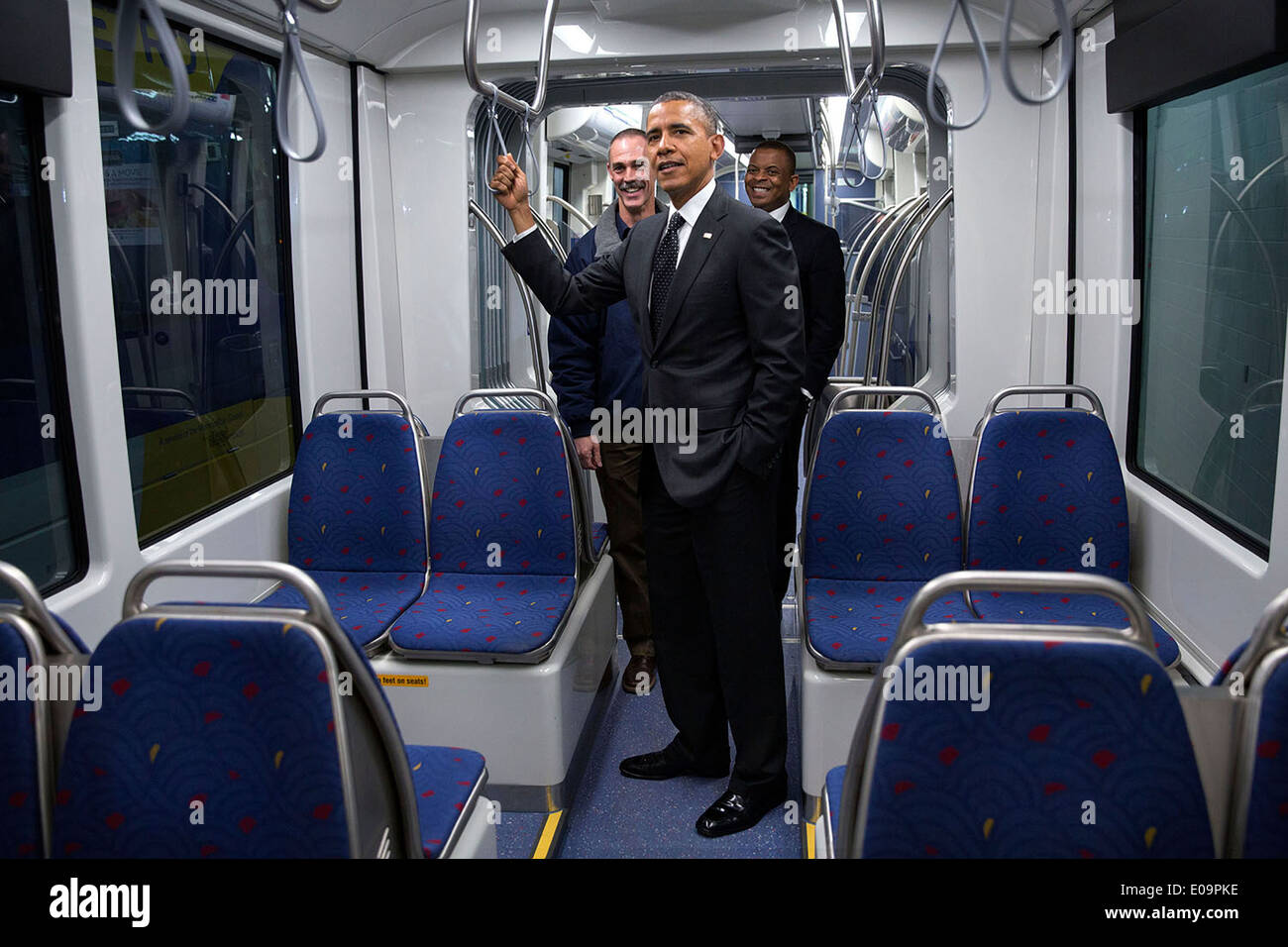 US President Barack Obama and Transportation Secretary Anthony Foxx tour the interior of a new light rail car at the Metro Transit Light Rail Operations and Maintenance Facility February 26, 2014 in St. Paul, Minnesota. Stock Photo