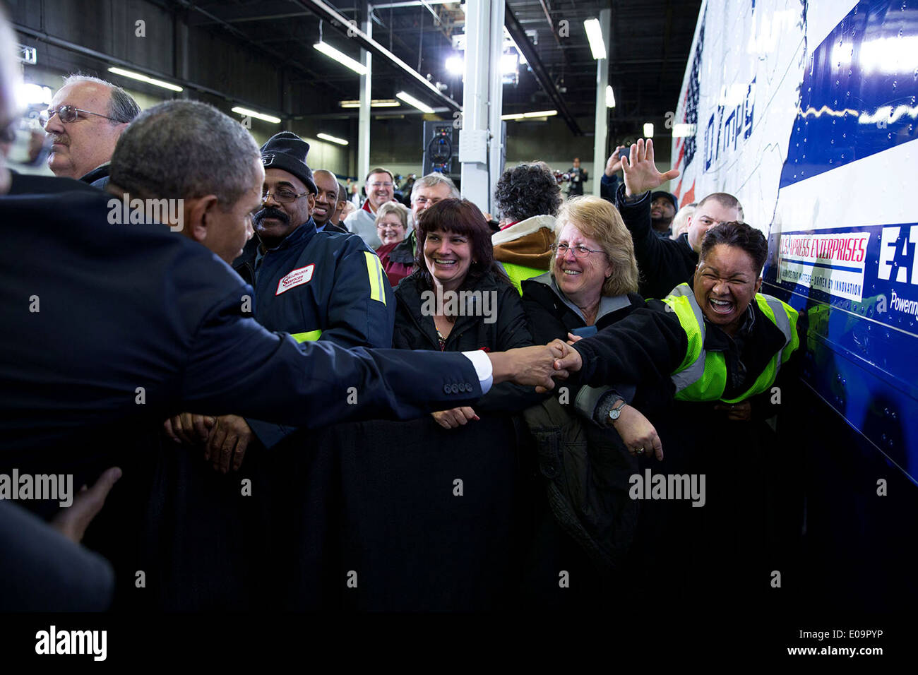 US President Barack Obama greets audience members after he delivers remarks on improving the fuel efficiency of American trucks, at the Safeway Distribution Center February 18, 2014 in Upper Marlboro, Maryland. Stock Photo