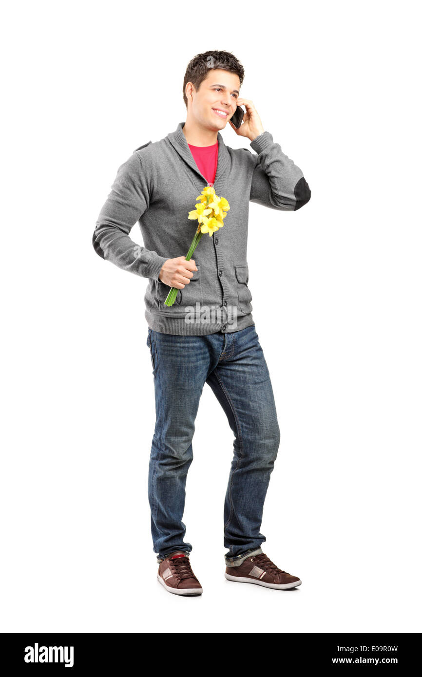 Full length man holding flowers Cut Out Stock Images & Pictures - Alamy