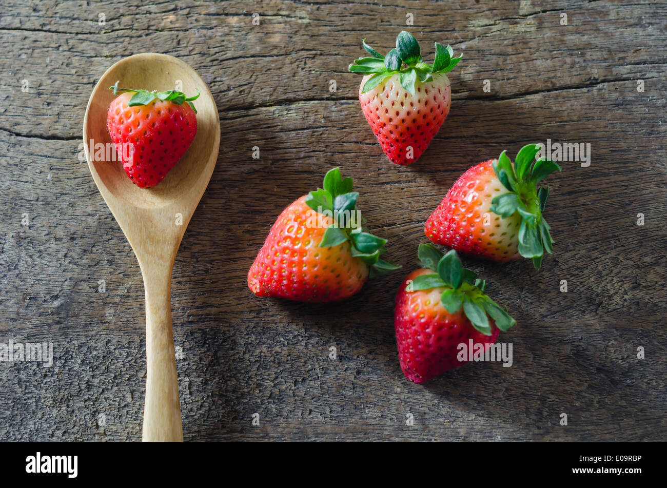 still life fresh strawberries over wooden background Stock Photo - Alamy