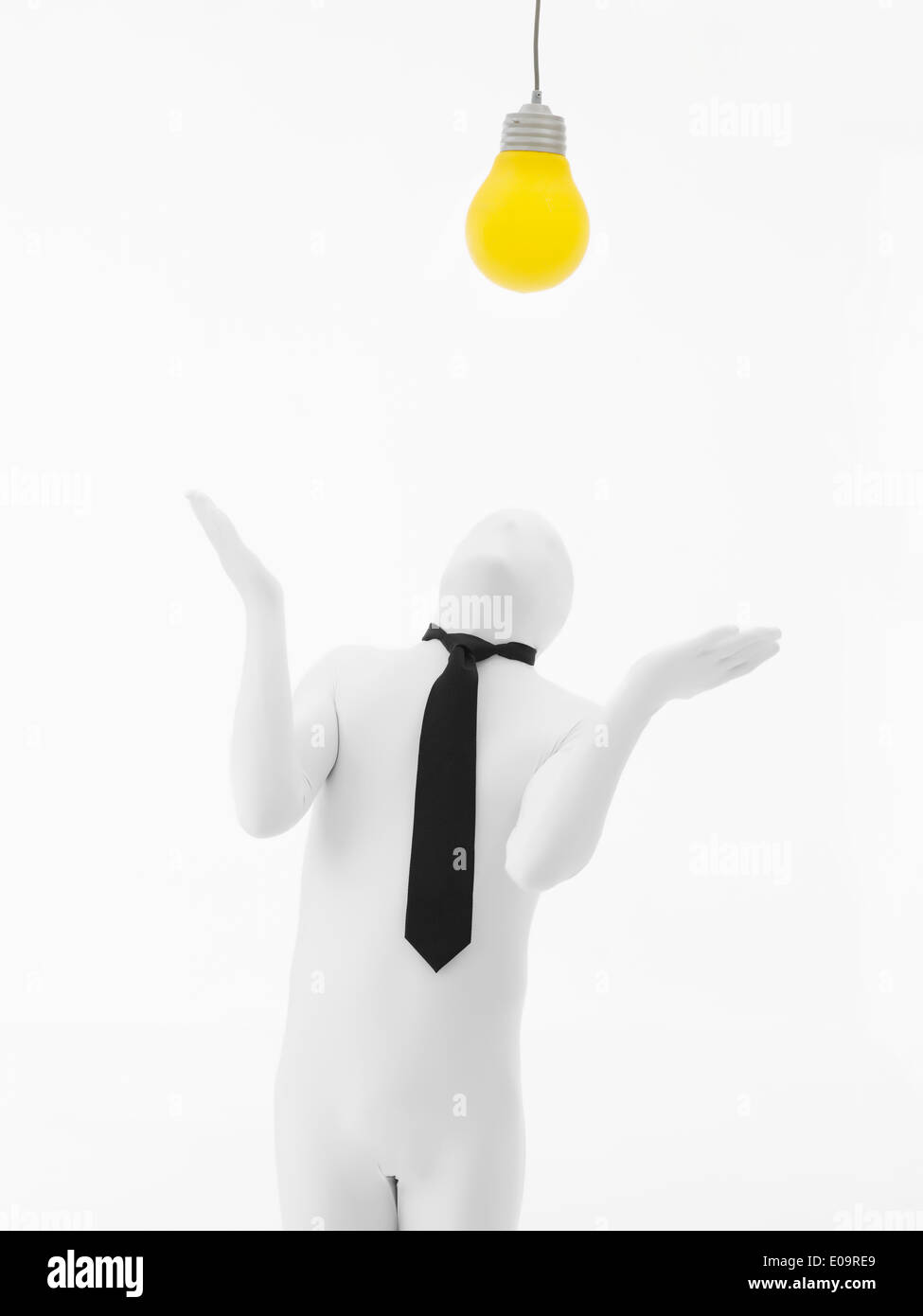 faceless man dressed in white with black tie with yellow bulb on top of ...