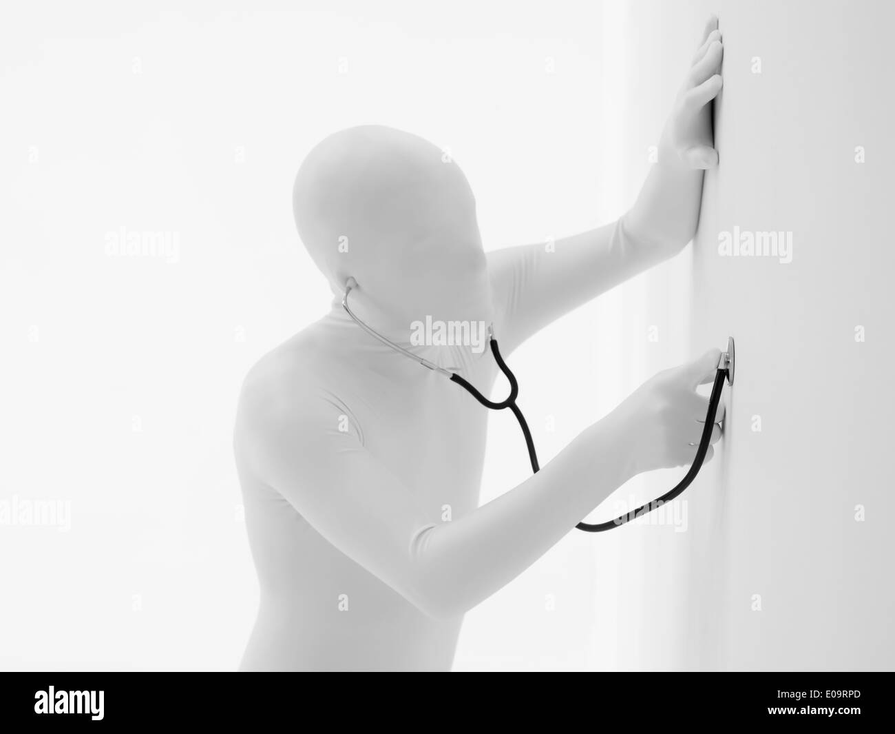 faceless man dressed in white with stethoscope in his ears, listening ...