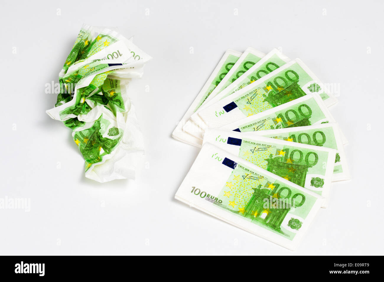 Crumpled and straight tissue handkerchieves looking like one hundred euro notes Stock Photo