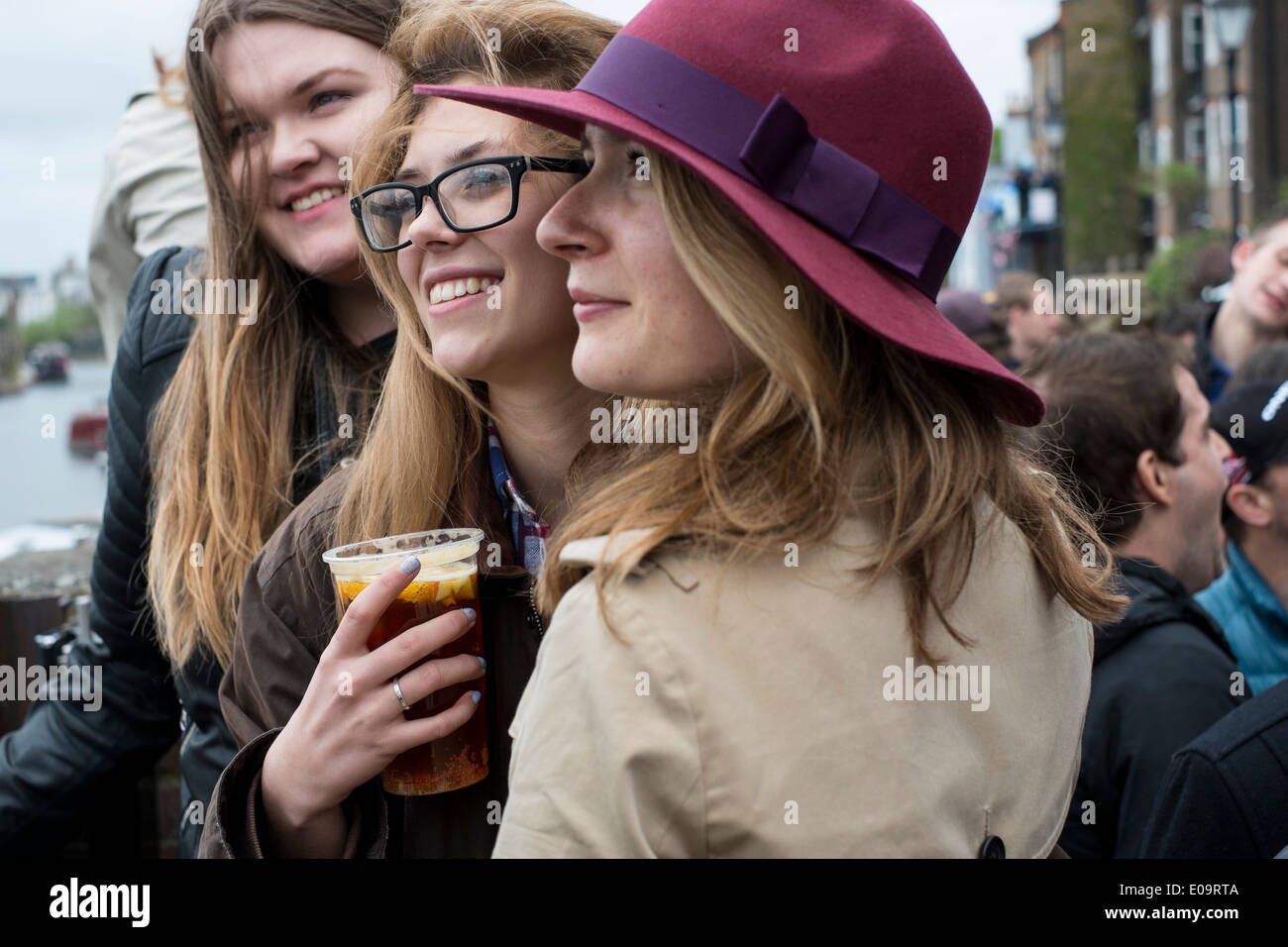 Spectators on the bank of the River Thames at Hammersmith during the annual Oxford and Cambridge Boat Race. Stock Photo