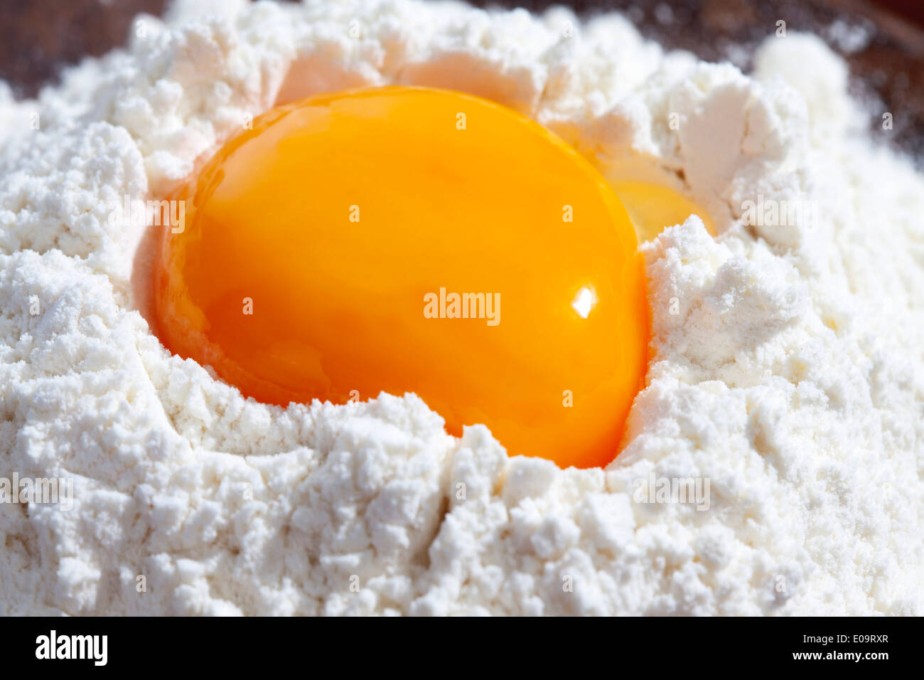 Egg yolk in flour Stock Photo