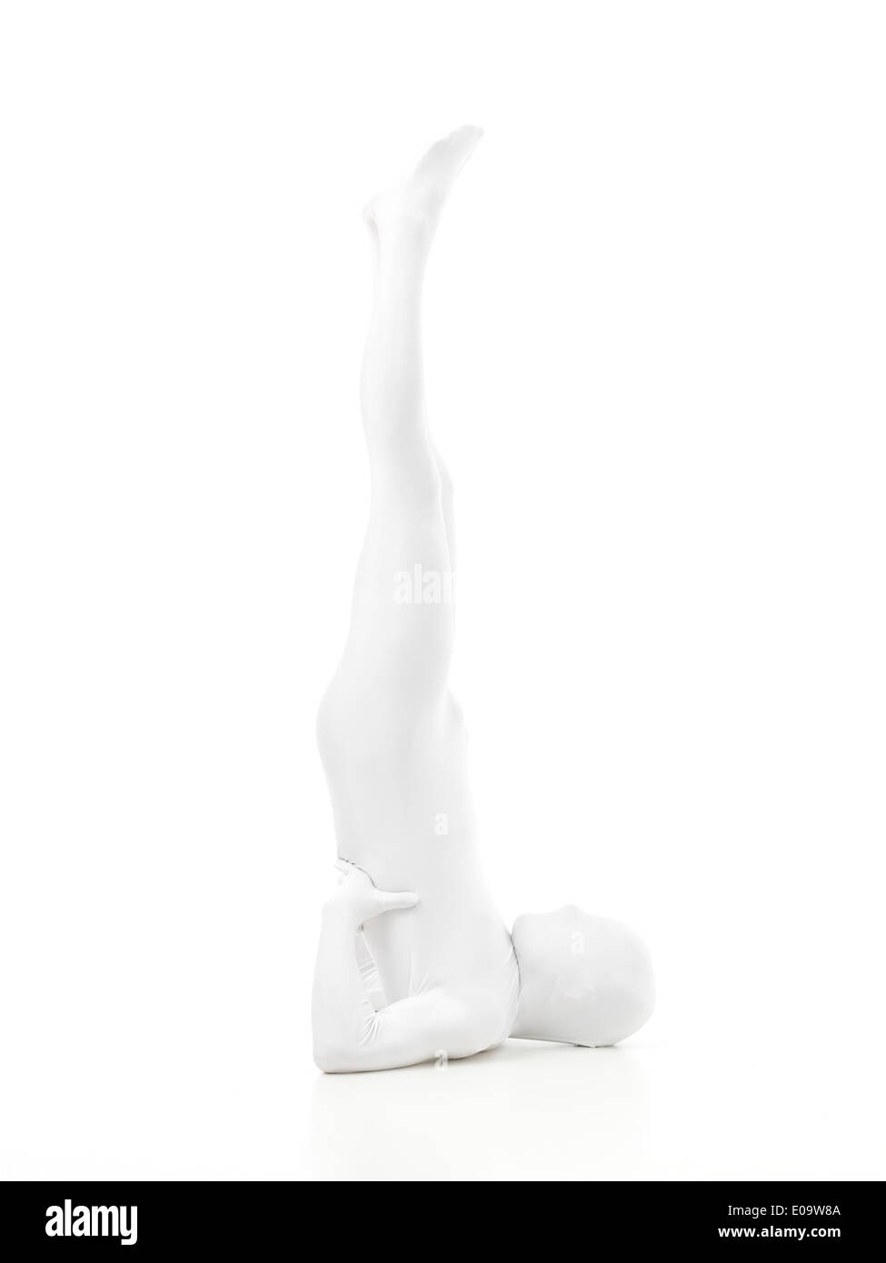 faceless man dressed white sitting in yoga position, reverse Sarvangasana Stock Photo