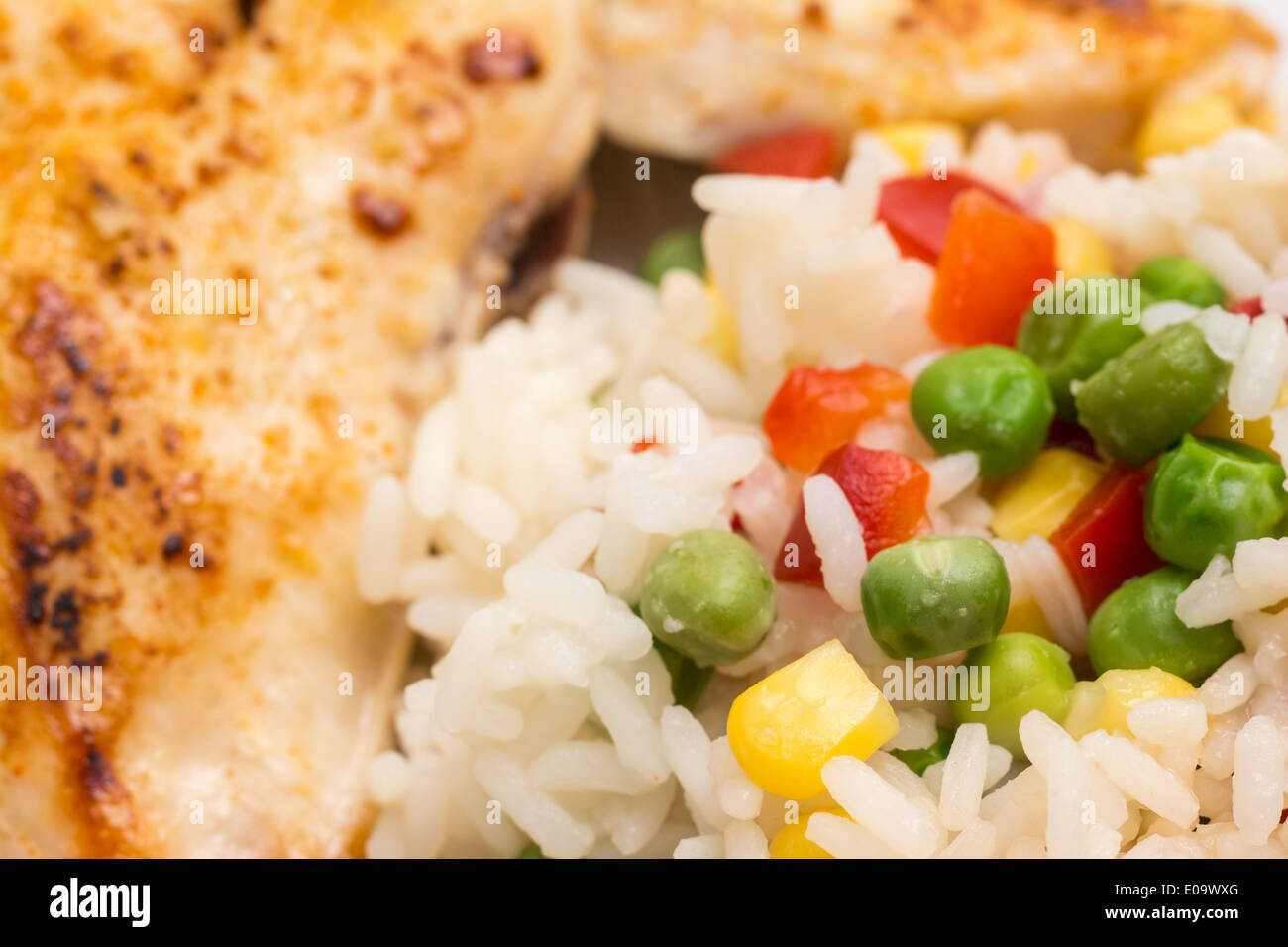 Rice With Vegetables And Chicken Stake Stock Photo