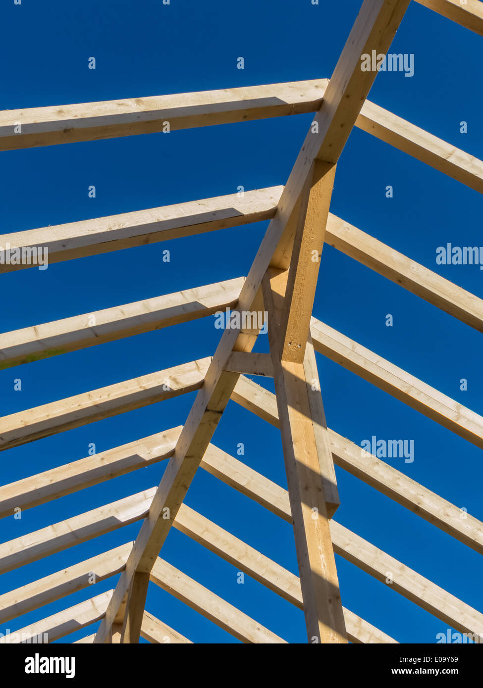 On a house a new roof is built on a building site. More sluggishly of wood for roof framework., Auf einem Haus wird auf einer Ba Stock Photo