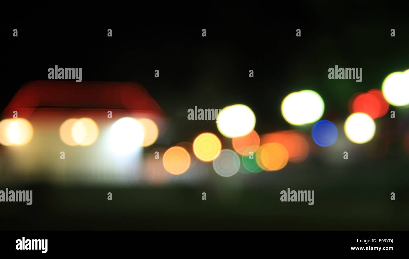 Holidays Lights in suburb. Blurry pattern of colorful decoration lights. Stock Photo