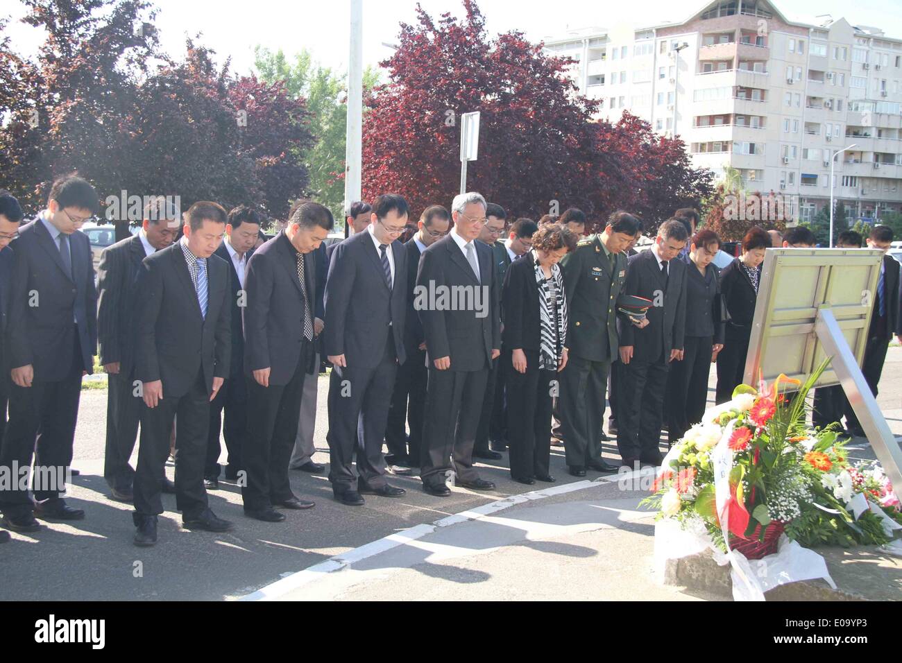 Belgrade, May 7. 7th May, 1999. Chinese ambassador to Serbia Zhang Wanxue (4th L, Front row) shows respect for three Chinese journalists killed in the U.S.-led NATO bombing of the Chinese embassy in Belgrade, in front of a monument in Belgrade, capital of Serbia, on May 7, 2014. Shao Yunhuan of Xinhua News Agency along with Xu Xinghu and his wife Zhu Ying from the Beijing-based Guangming Daily newspaper were killed in the missile attack which inflicted serious damage to the embassy buildings on the evening of May 7, 1999. Credit:  Wang Hui/Xinhua/Alamy Live News Stock Photo