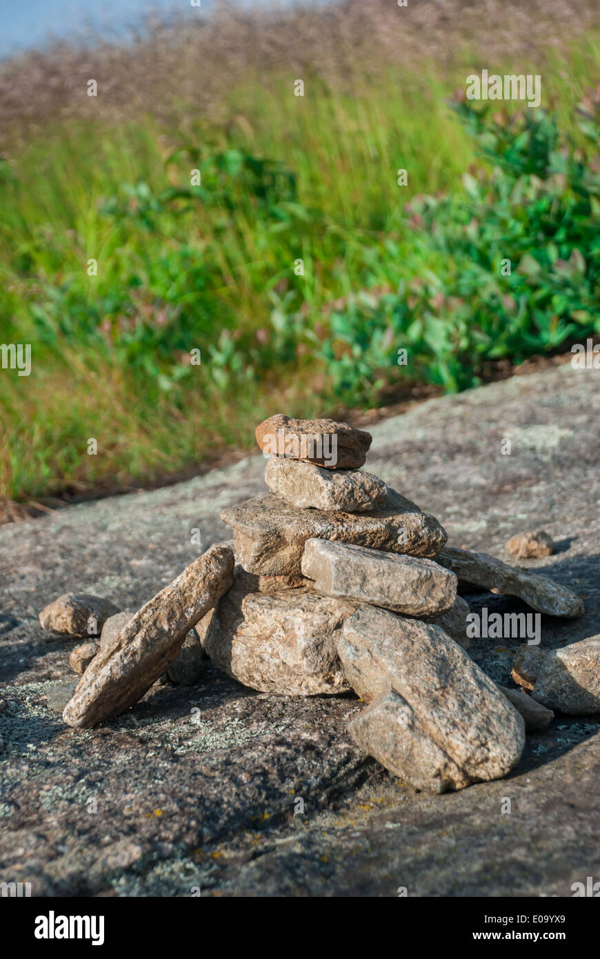 A small rock cairn grows as Appalachian Trail hikers pass this landmark Stock Photo
