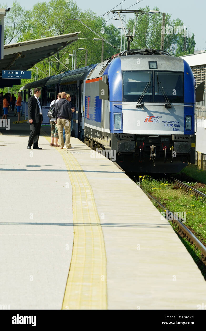Express train pulled by Siemens EuroSprinter es64u4 locomotive on May 1, 2014 at Warsaw East railway station, Poland. Stock Photo