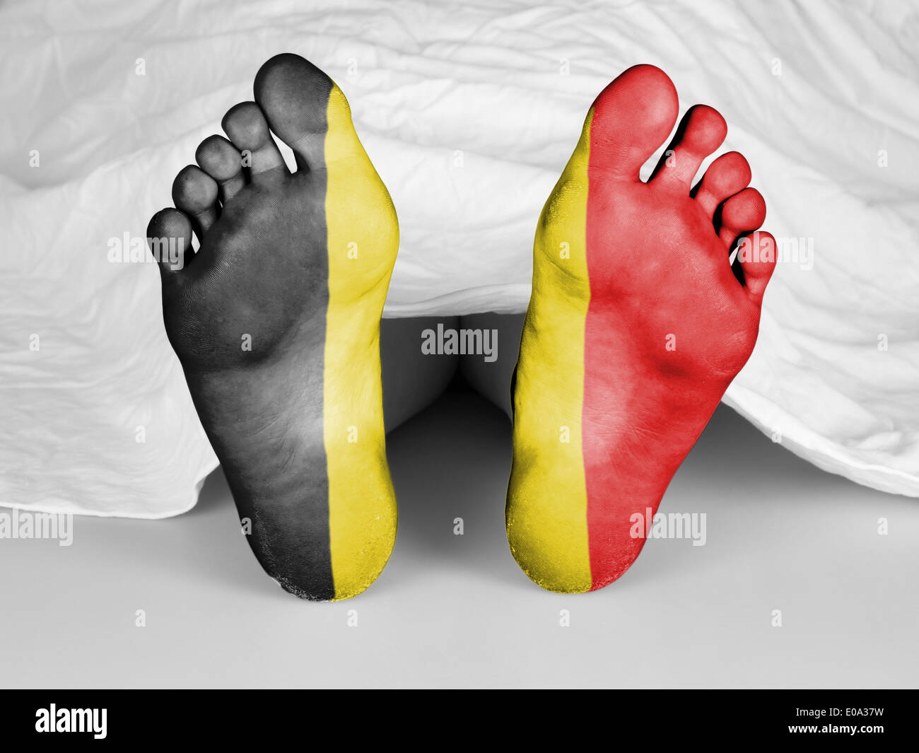 Dead body under a white sheet  flag of Belgium Stock Photo
