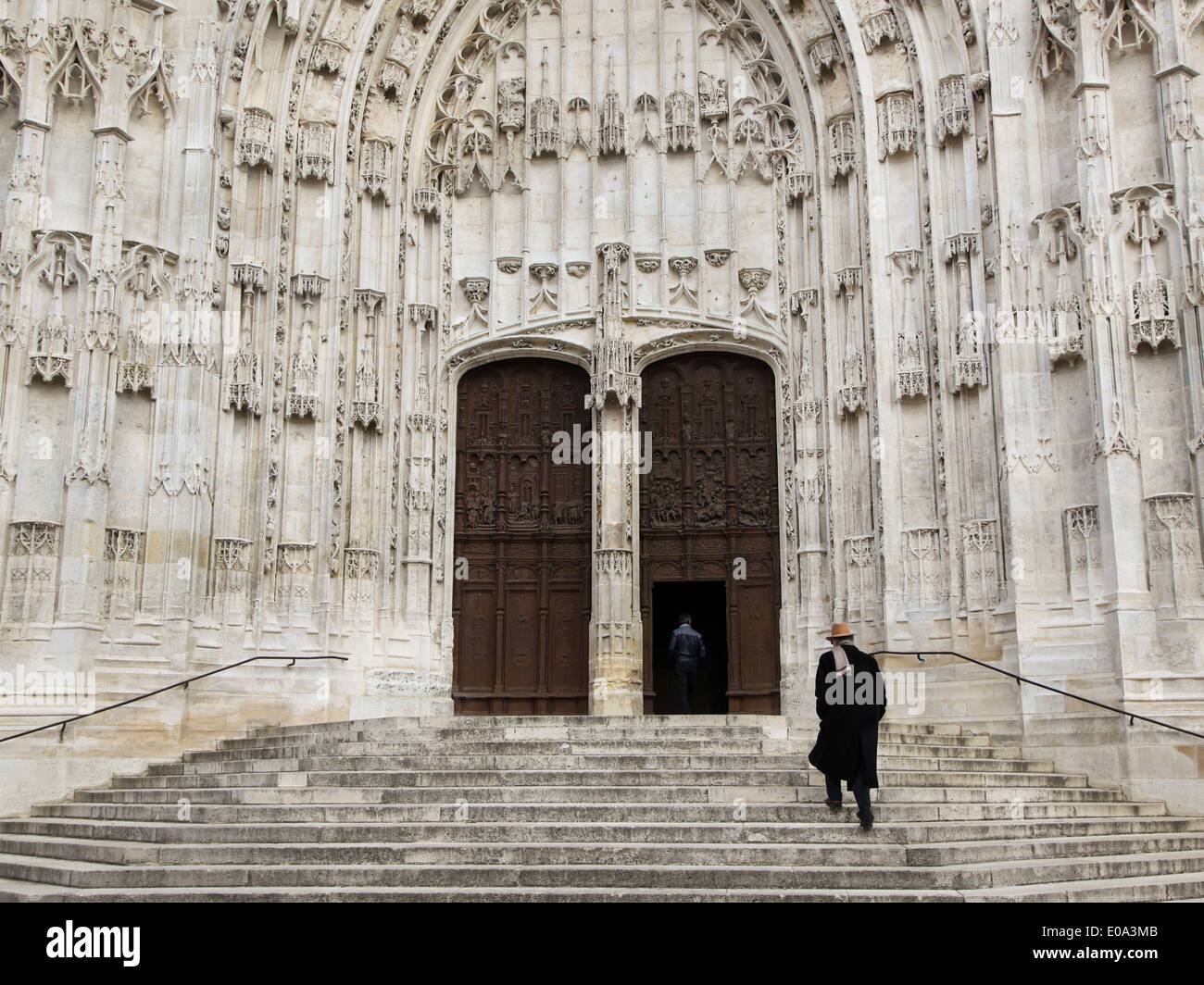 People entering the Cathedral in Beauvais, France Stock Photo