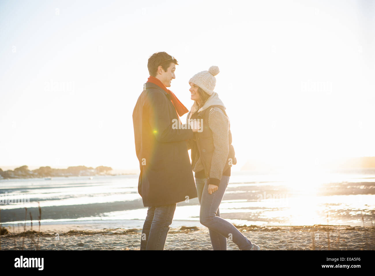Romantic couple face to face on the beach Stock Photo