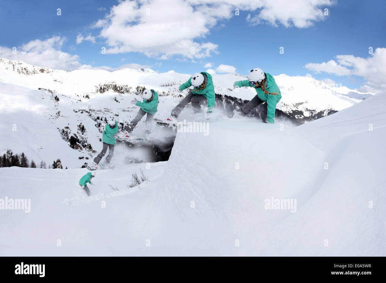 Multi exposure of young woman snowboarding on mountain, Mayrhofen, Tyrol, Austria Stock Photo