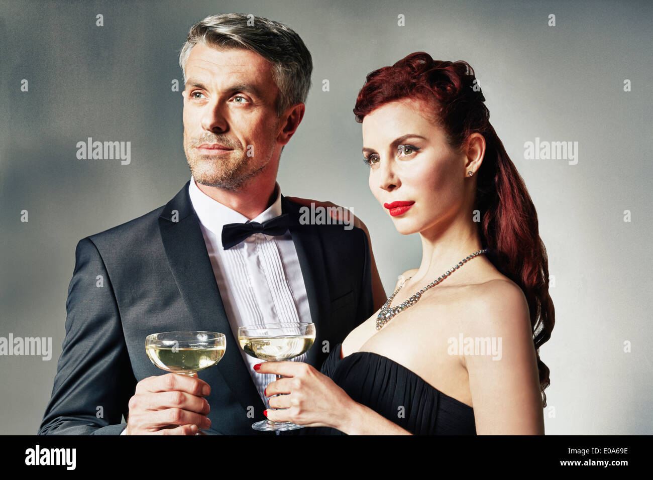 Portrait of couple celebrating with toast Stock Photo - Alamy