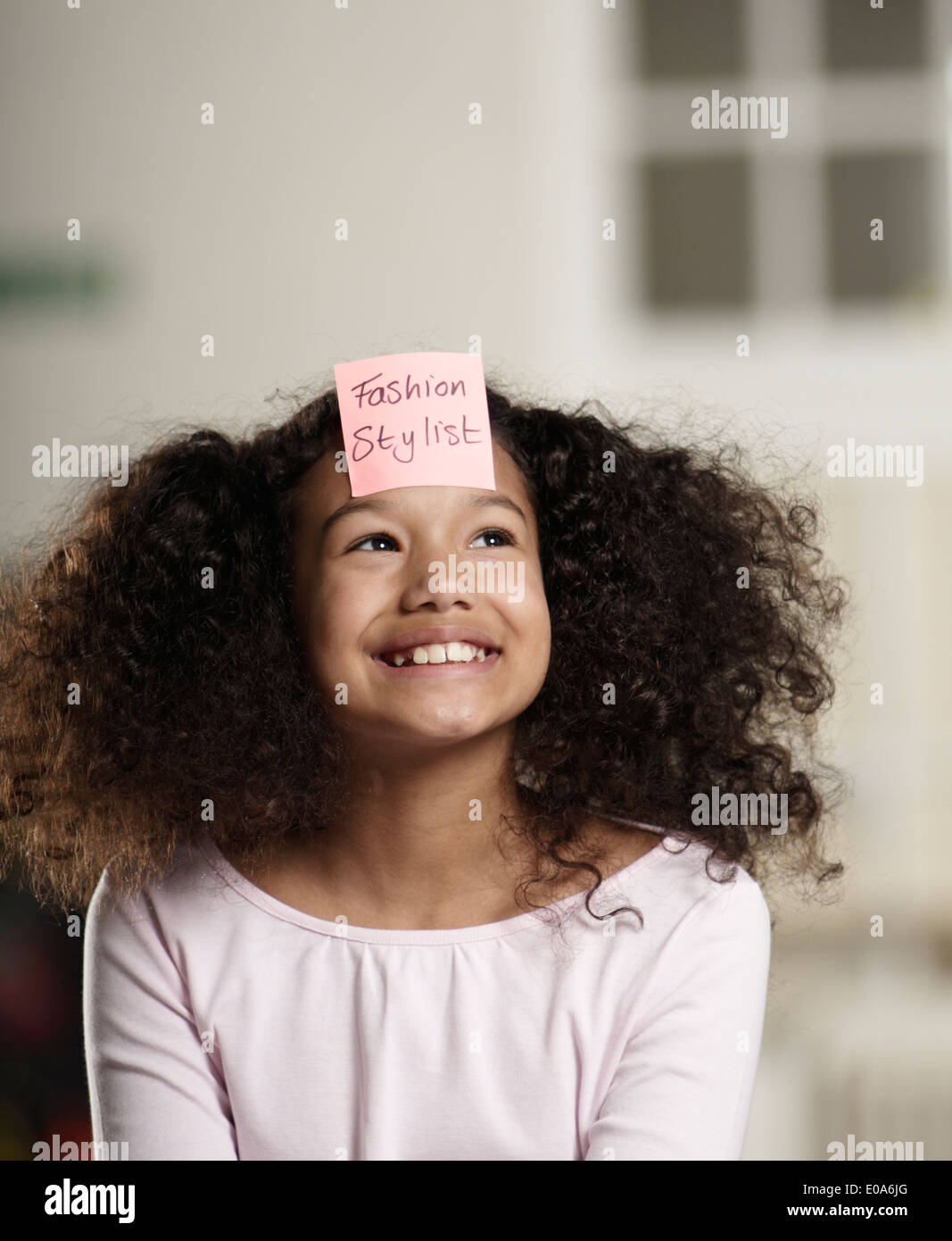 Closeup of sticky note with a orthographic message over heart shaped