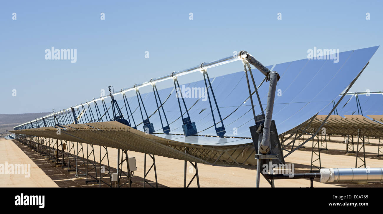 solar electric power plant parabolic mirrors concentrating sunlight Stock Photo