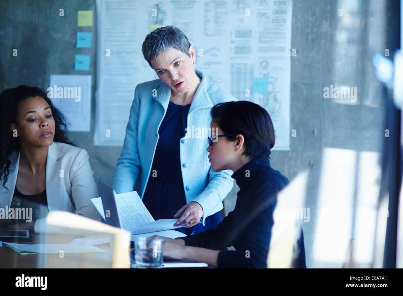 Three businesswomen meeting in boardroom Stock Photo