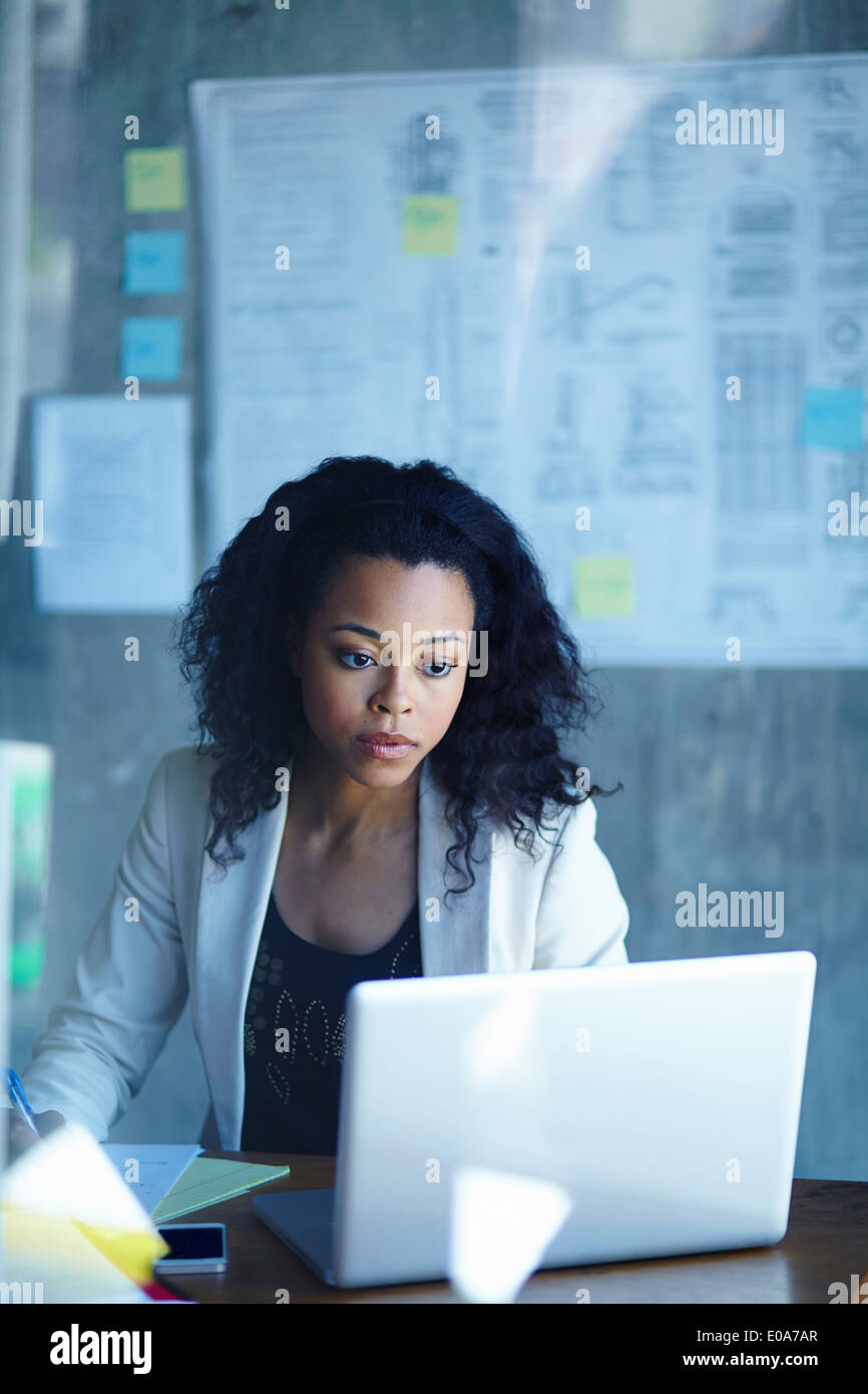 Young businesswomen working on laptop in office Stock Photo