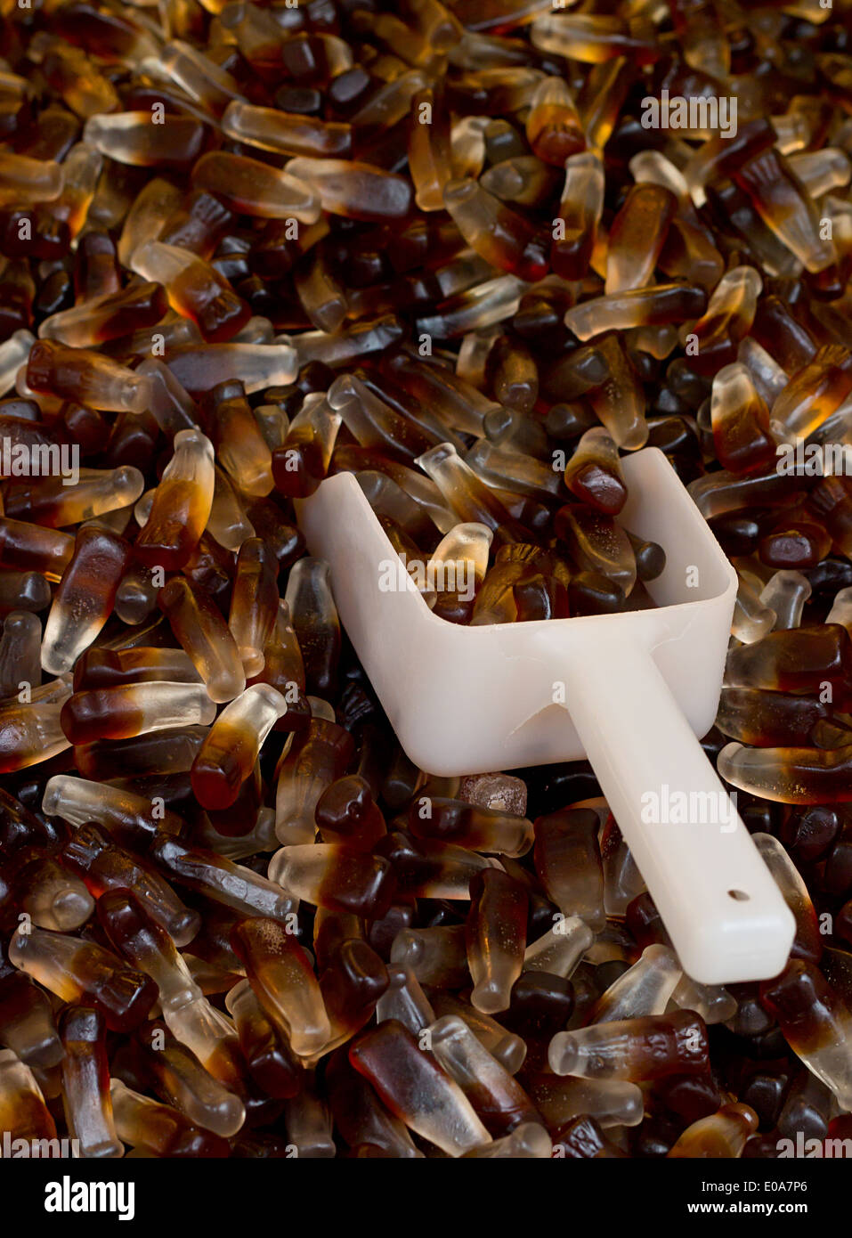 Chewy Cola Bottles a popular retro sweet also known as Gummy candy at a pick and mix self service market. Stock Photo