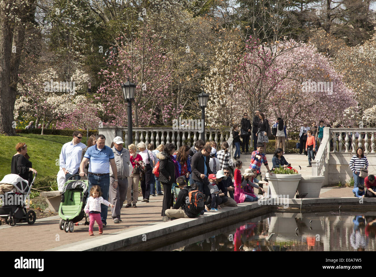 People Enjoy A Beautiful Spring Day In Magnolia Plaza At The