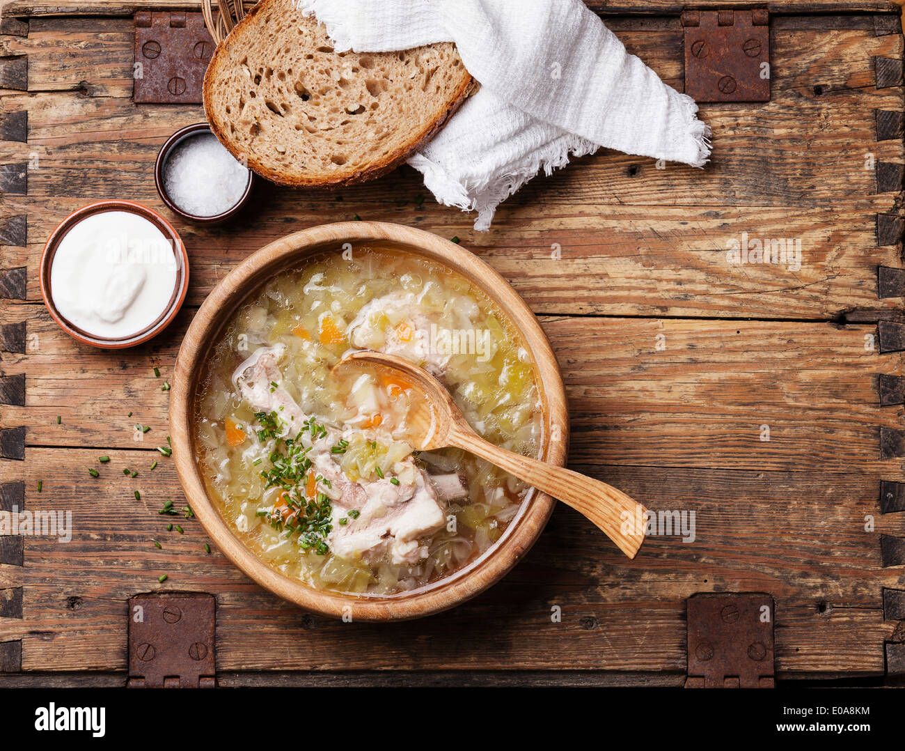 Homemade cabbage soup shchi with sour cream and bread Stock Photo