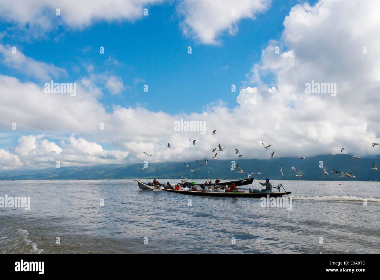 Ferry boat on Inle Lake at sunset, Shan State, Myanmar Stock Photo