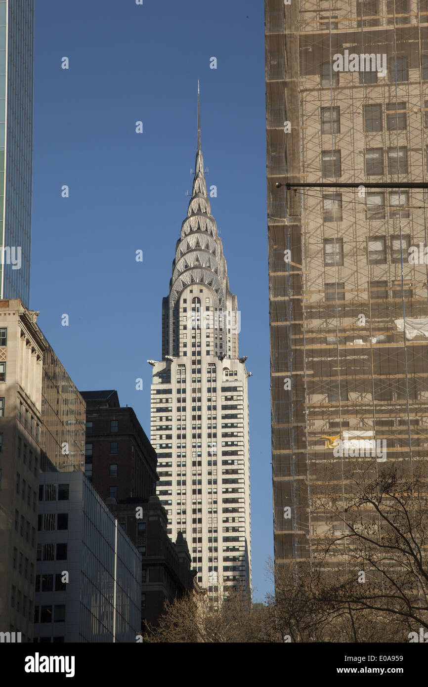 The classic Chrysler building framed between buildings along 42nd St. NYC. Stock Photo