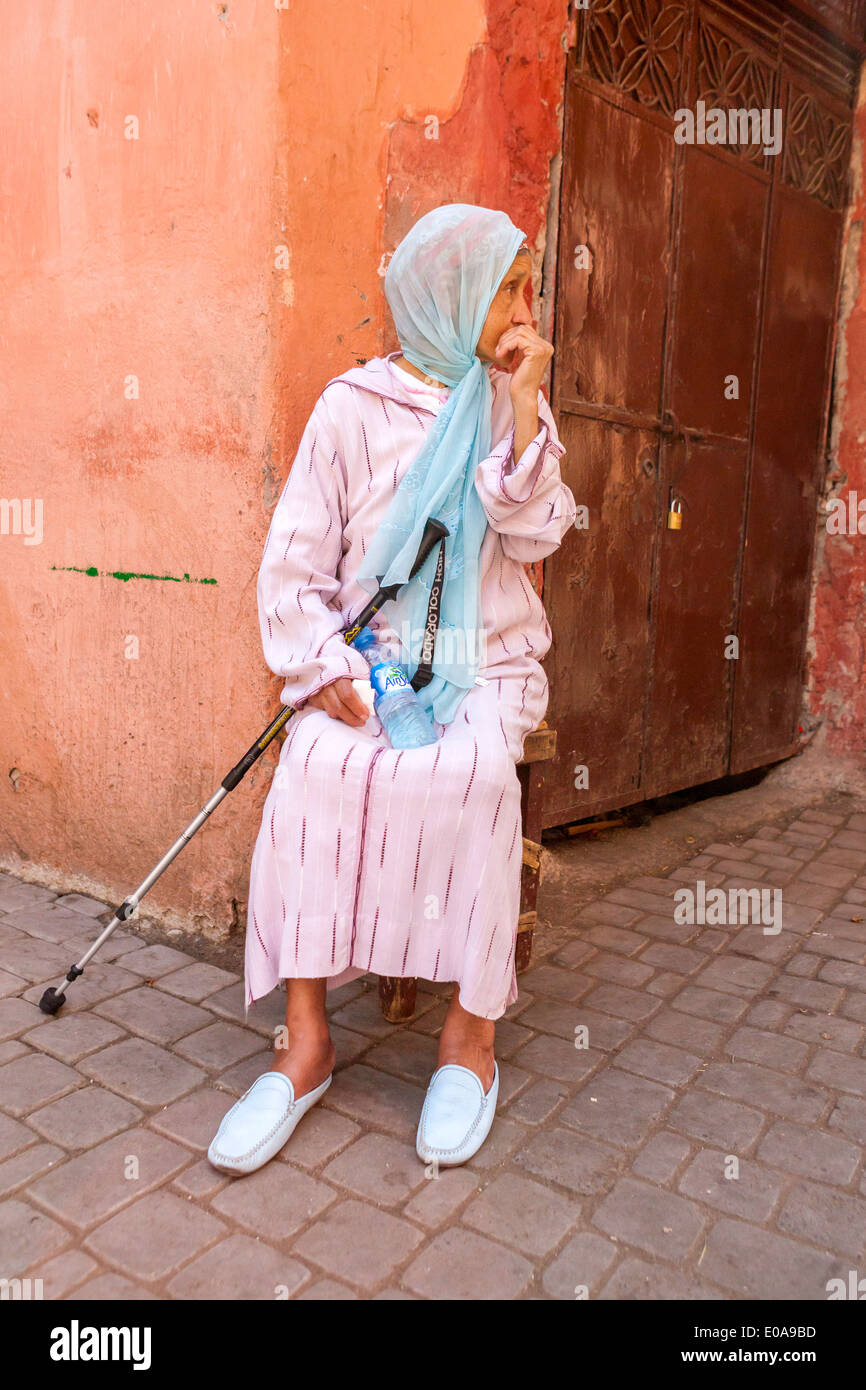 Woman siting at the Medina, Marrakech, Morocco. Stock Photo