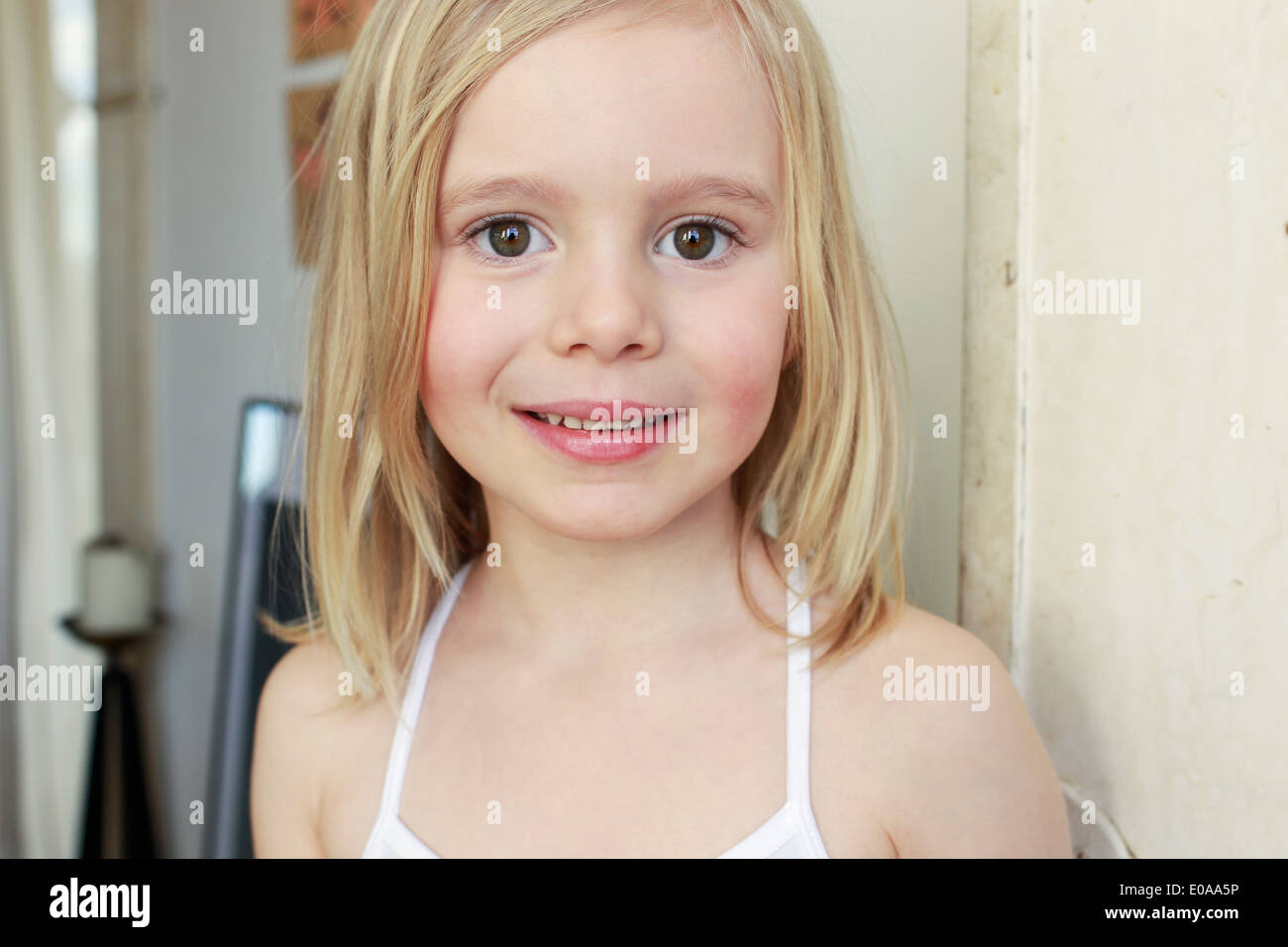 Portrait of innocent young girl in corridor Stock Photo