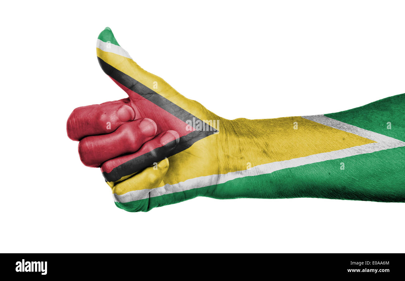 Old woman giving the thumbs up sign  isolated  flag of Guyana Stock Photo