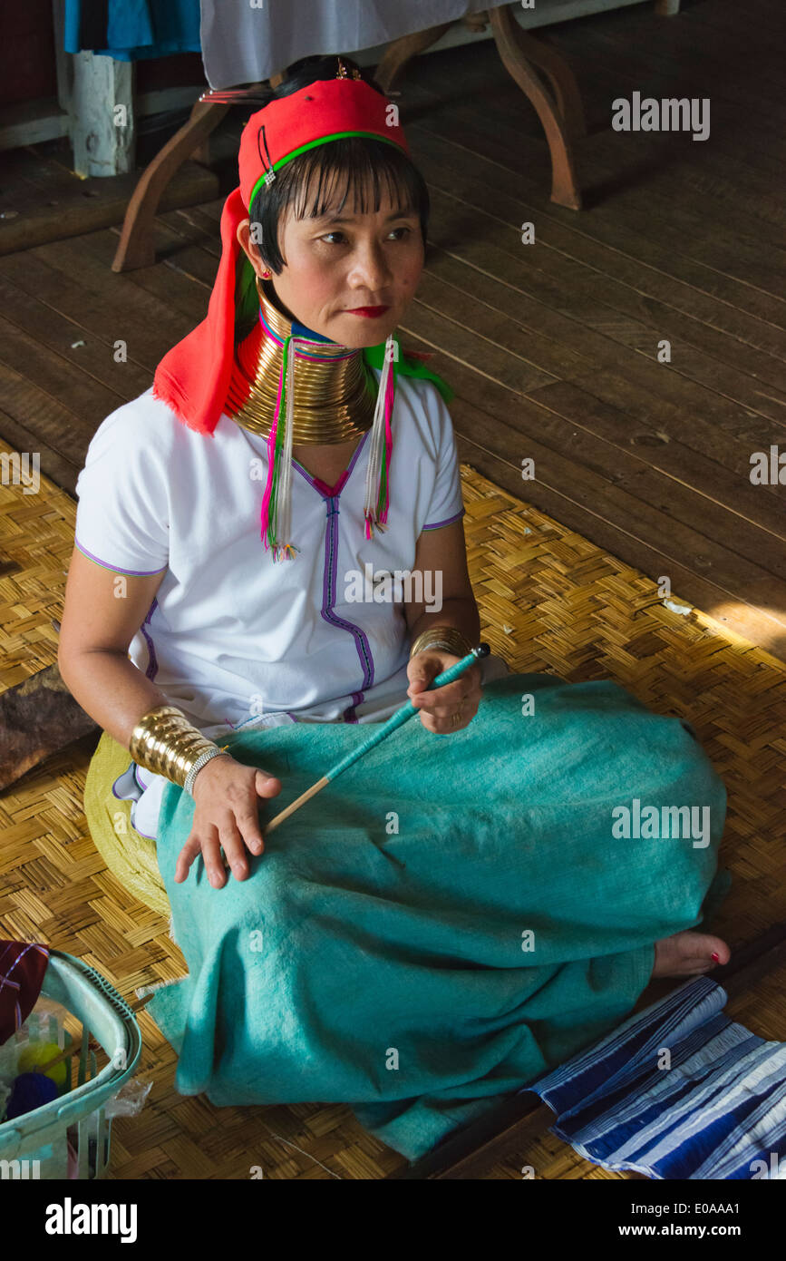 Padaung (Kayan Lahwi) woman wearing brass neck coils weaving, Inle Lake, Shan State, Myanmar Stock Photo